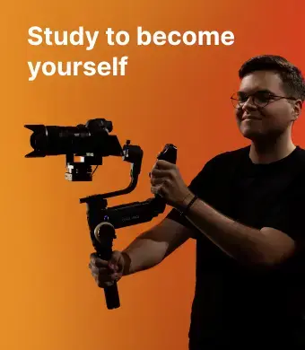 A student of the KTU Faculty of Social Sciences, Humanities and Arts - a young man wearing glasses and dark clothes is holding a professional video camera mounted on a stabilizer, standing against a gradient orange to red background. On the left, white bold text reads “Study to become yourself.”